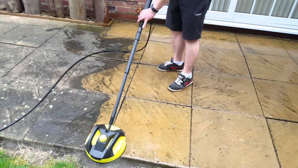 Cleaning the patio with a pressure washer